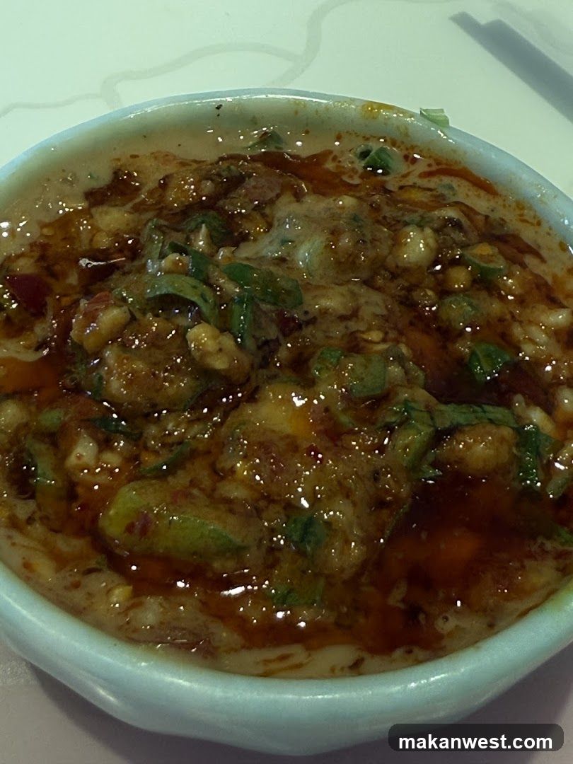 Spicy Noodle Dish with Peanuts and Greens