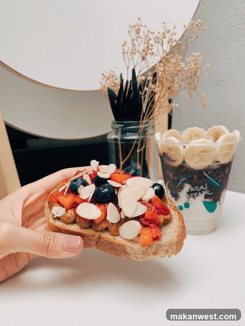 Toast with fruit and nuts and acai bowl