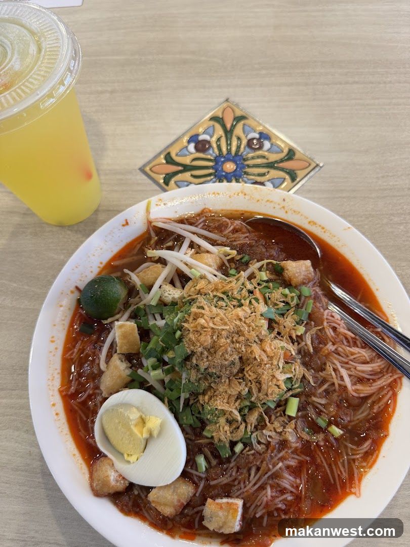 Spicy Noodle Dish with Side Drink