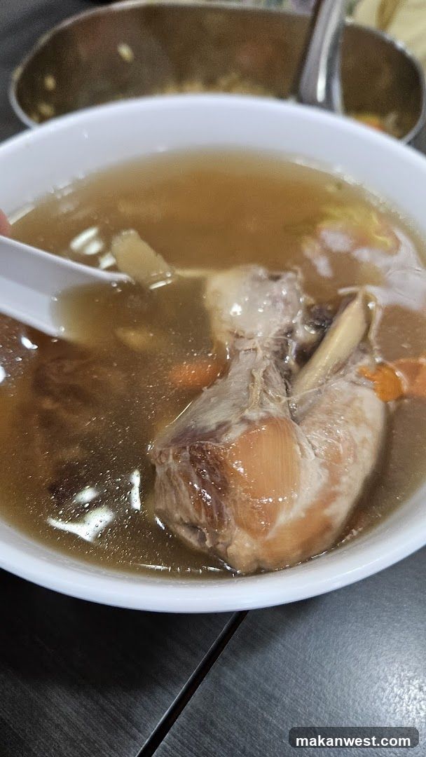 Bowl of Soup with Meat and Vegetables