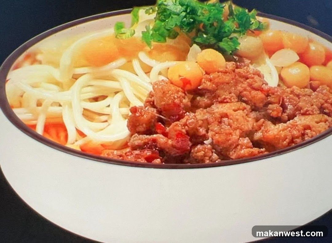 Bowl of Noodles with Meat Sauce and Vegetables
