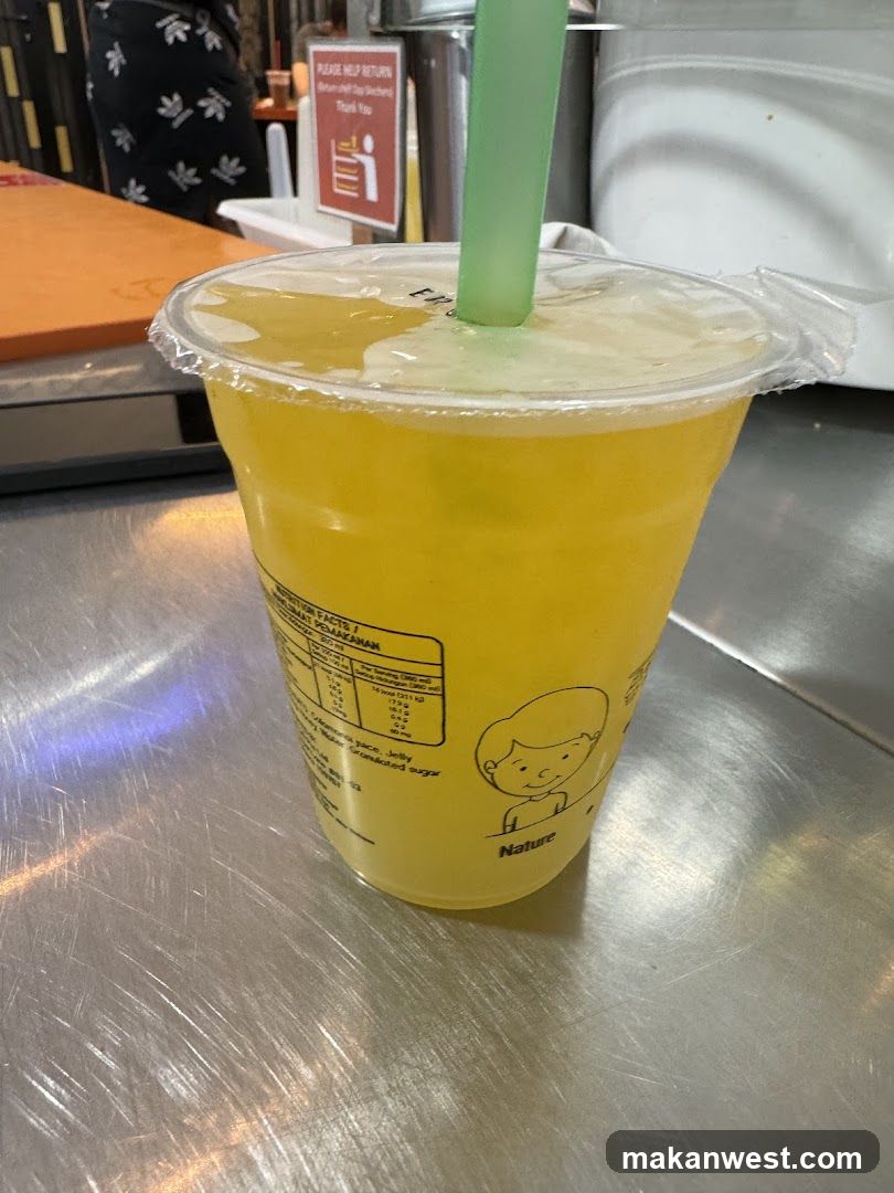 Yellow Drink in Plastic Cup
