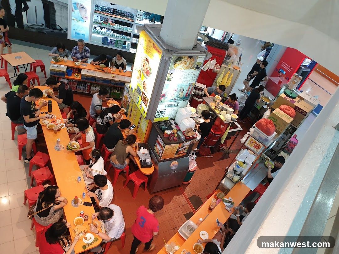 Busy Food Stall with Diners