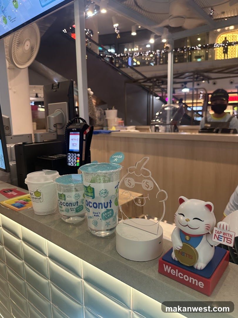 Counter with Coconut Drinks and Maneki-neko