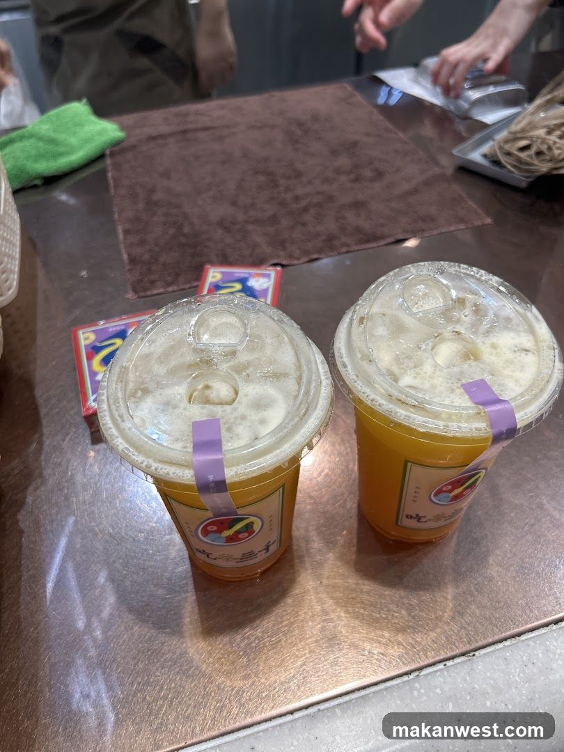 Two drinks with purple stickers