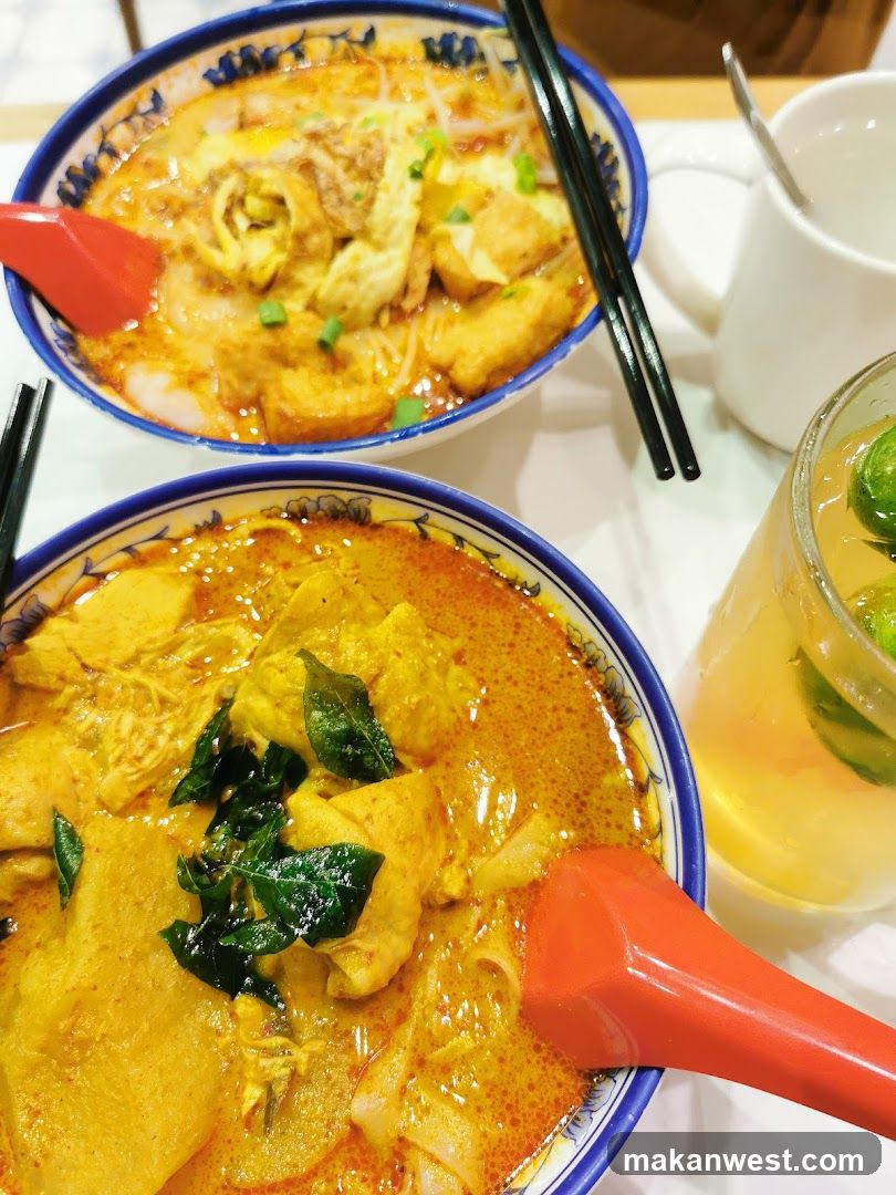 Two bowls of curry noodles