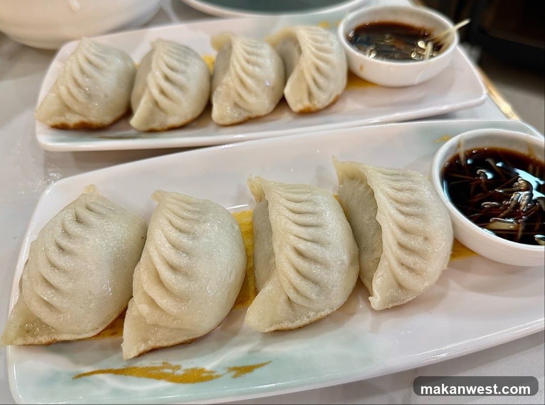 Pan-fried dumplings with dipping sauce