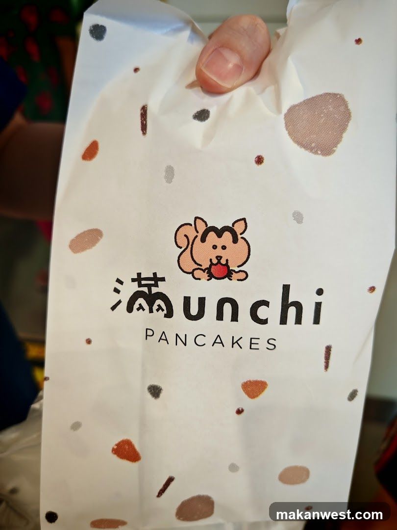 Paper bag with cartoon squirrel and text