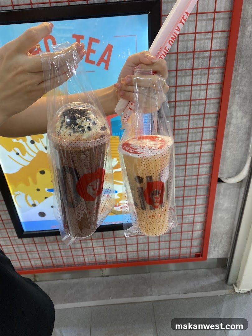 Two drinks in plastic bags