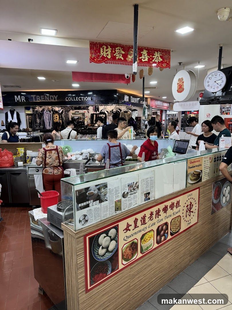 Food Stall with Clothing Store in Background