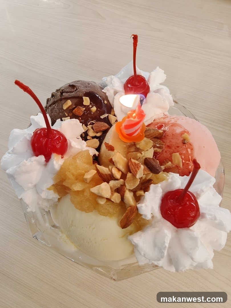 Ice Cream Sundae with Cherries and Candle