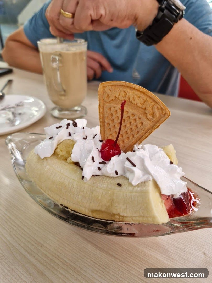 Banana Split with Whipped Cream and Cherry