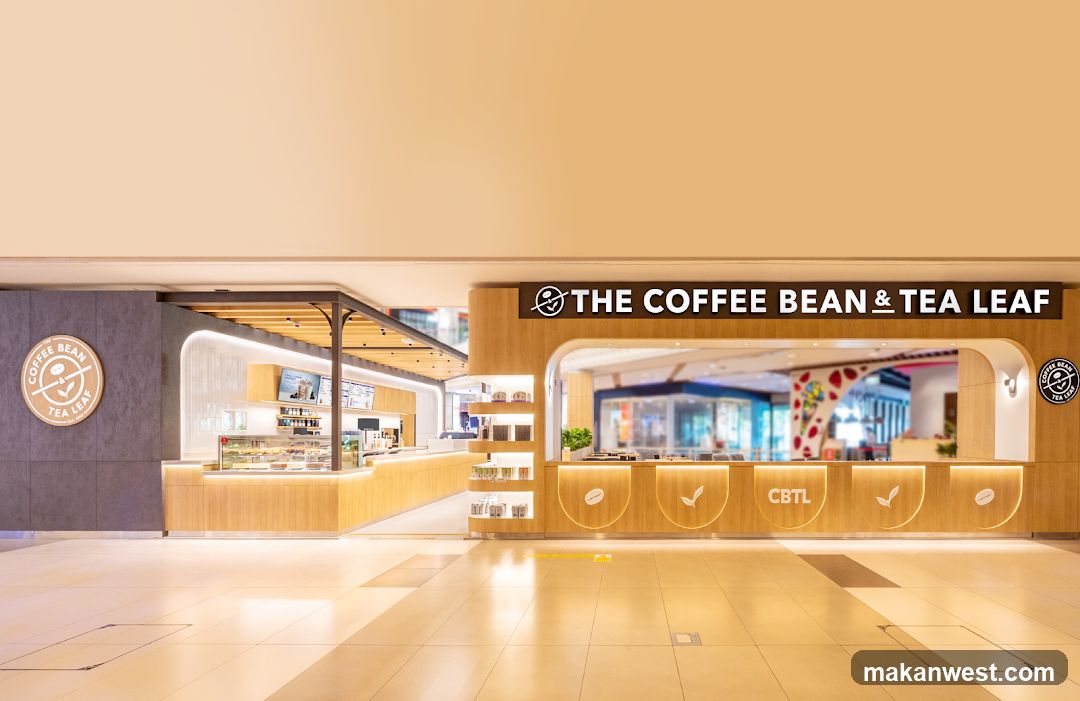 A modern and clean storefront for The Coffee Bean & Tea Leaf, featuring warm wood accents and bright lighting. The counter area displays pastries and drinks, with menu boards visible behind the counter. The exterior signage is prominent, with the brand logo and name clearly displayed.