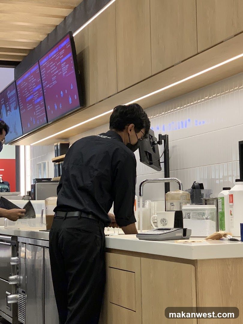 Staff preparing drinks behind a counter