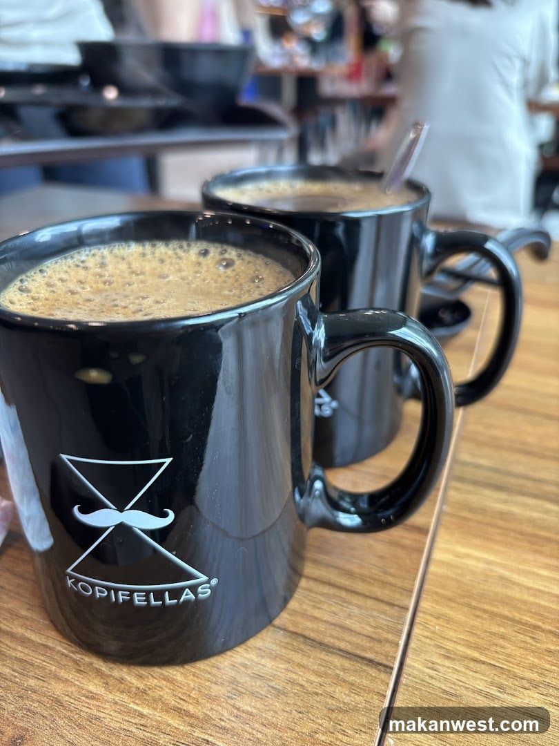 Two black mugs of coffee