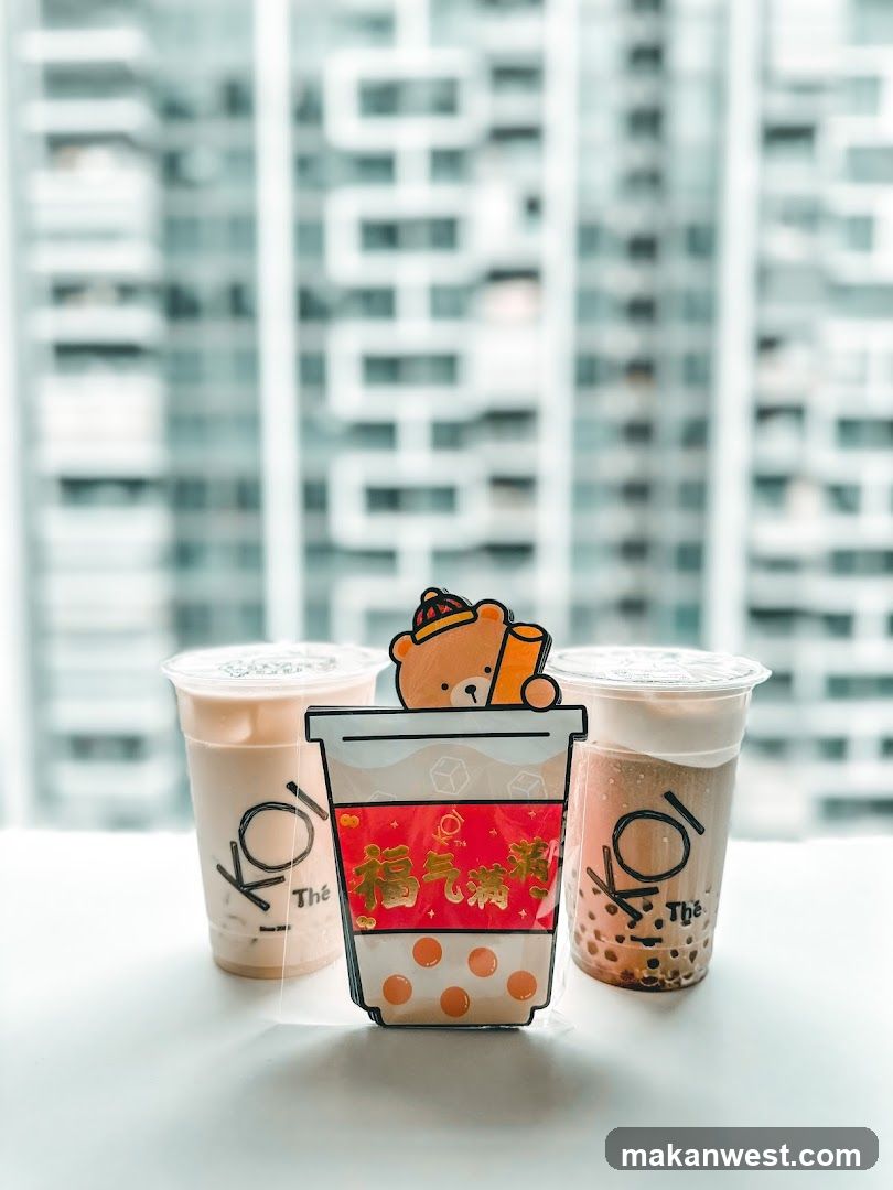 Two bubble tea drinks with a decorative cup cutout
