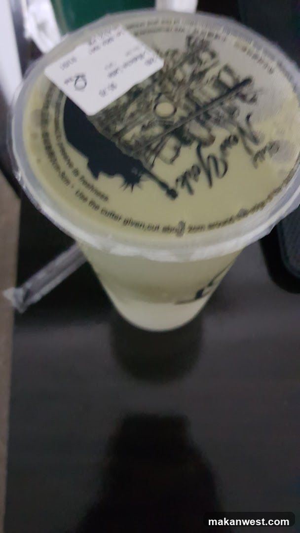 Beverage with New York Themed Lid
