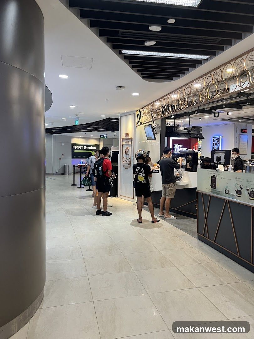 People queuing at a food stall