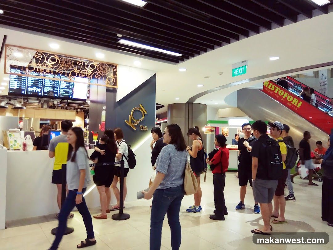 People queuing at a food stall