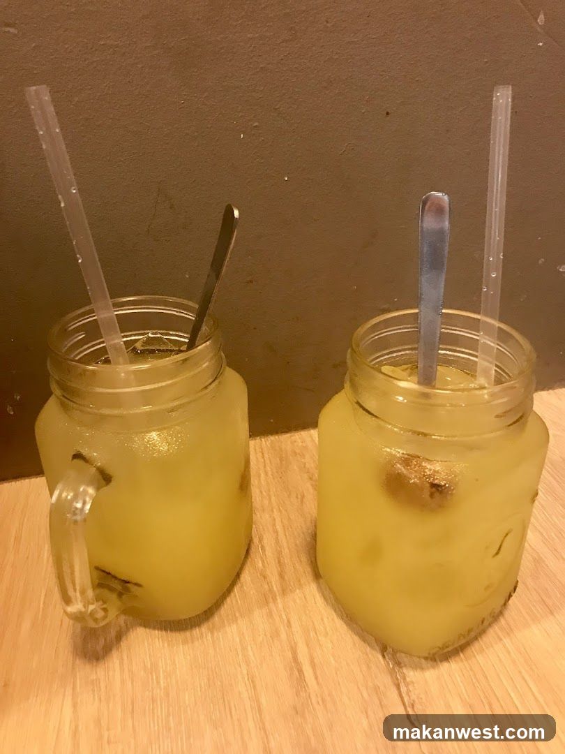 Two drinks in mason jars