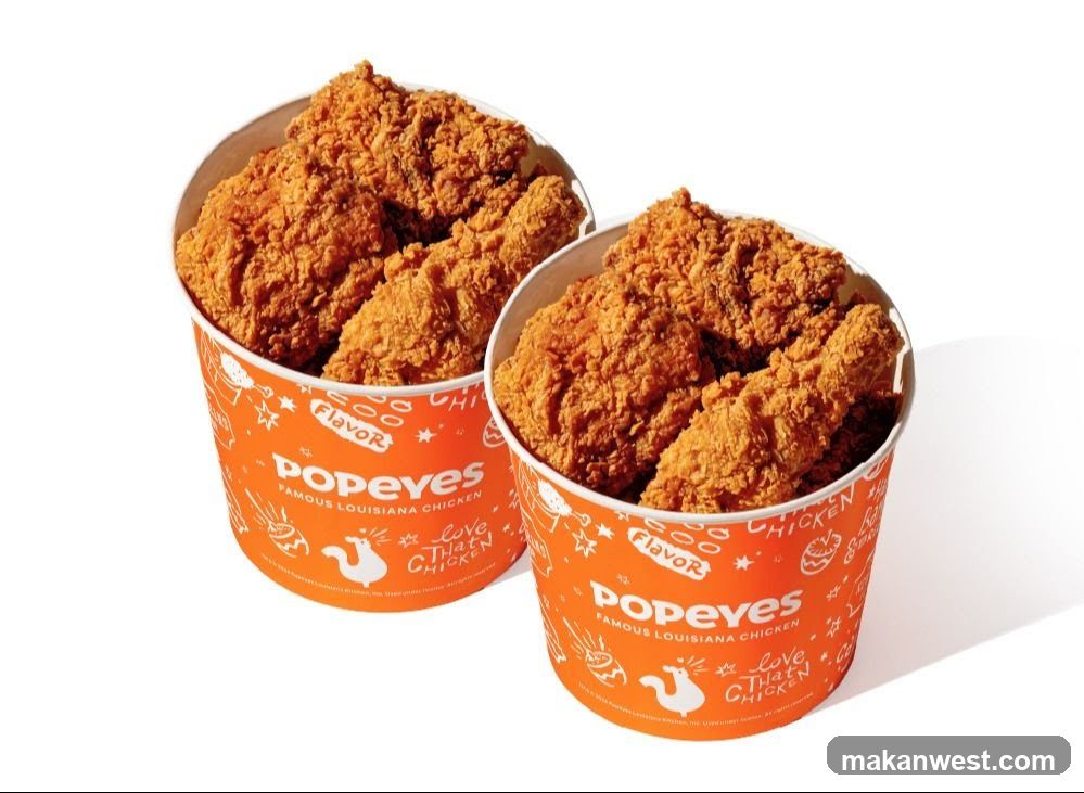 Two buckets of Popeyes fried chicken