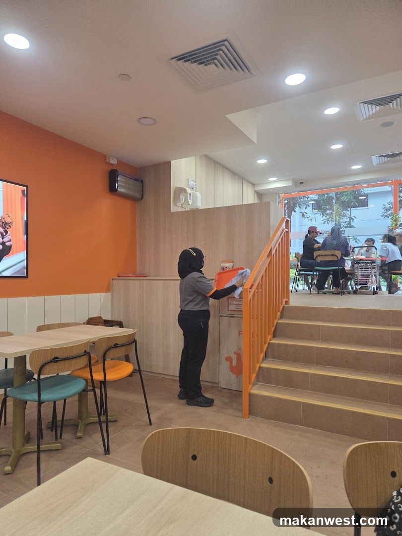 Restaurant Interior with Staff Cleaning