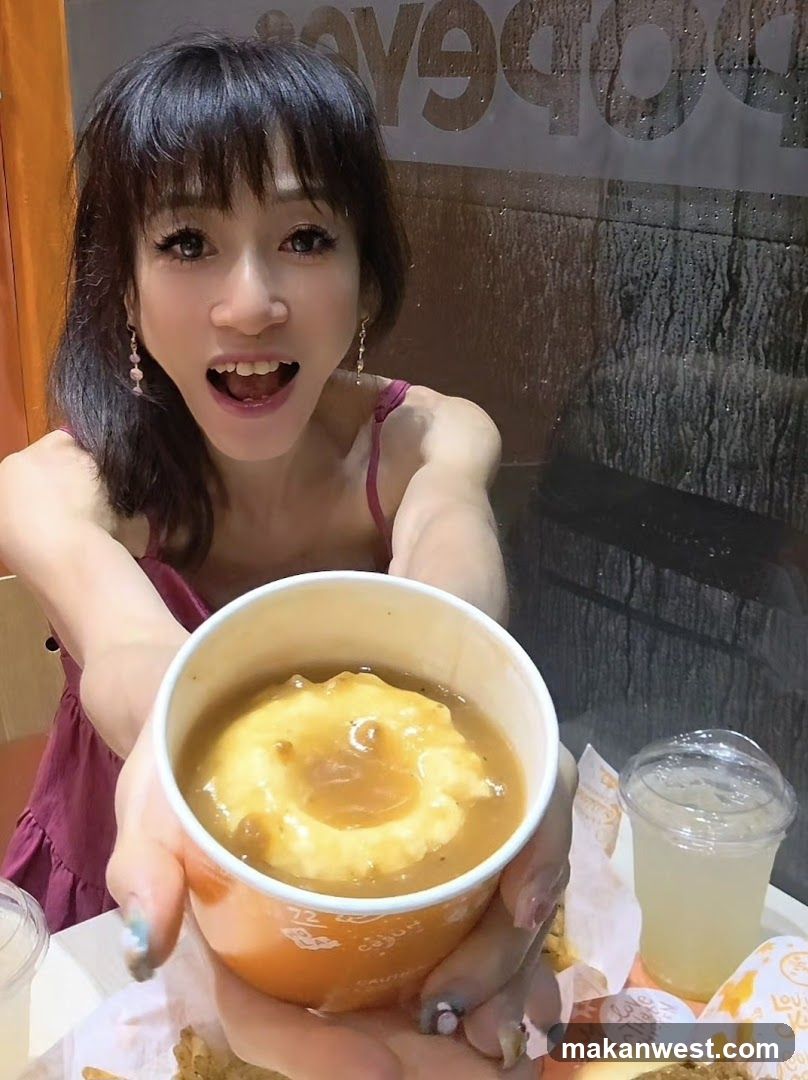 Woman holding mashed potatoes with gravy