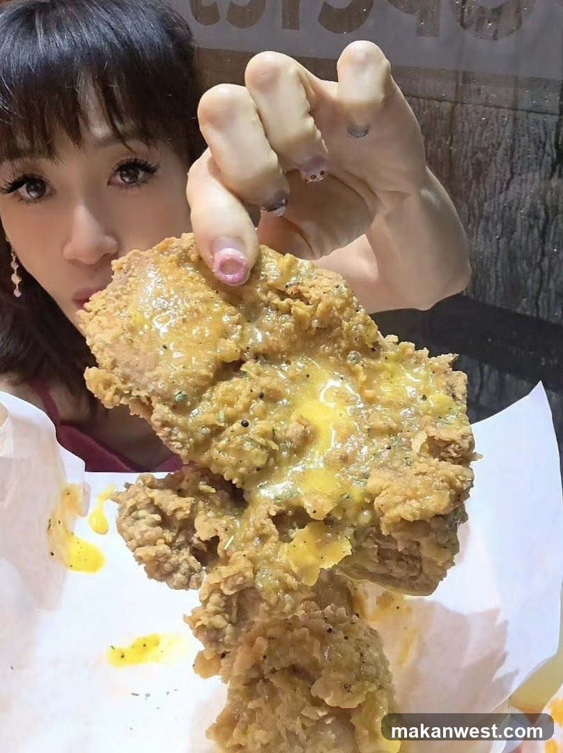 Woman holding fried chicken