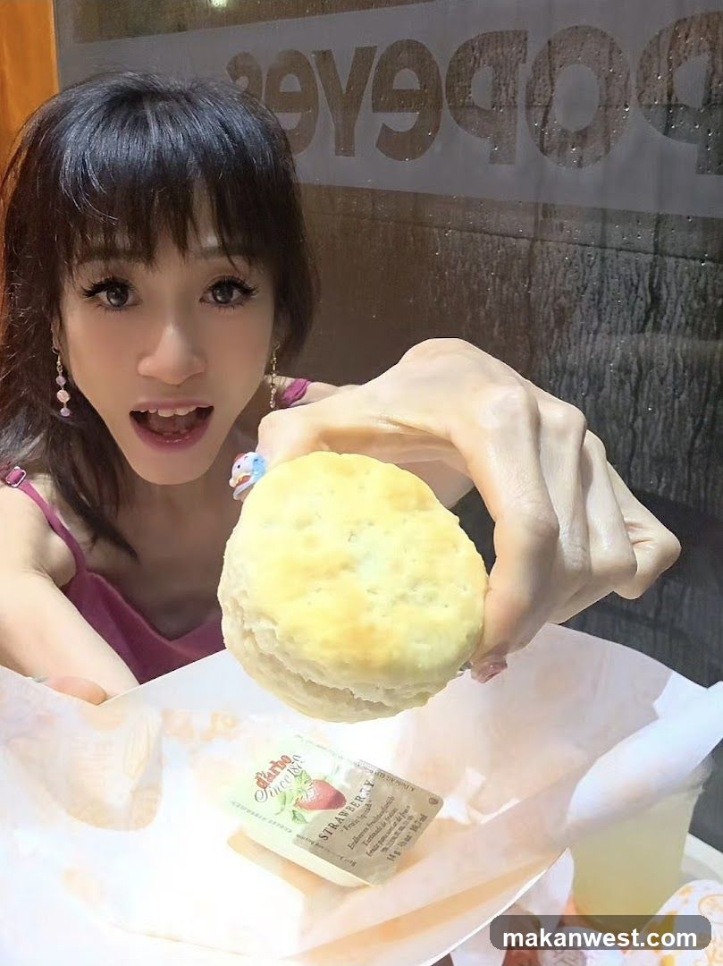 Woman holding a biscuit