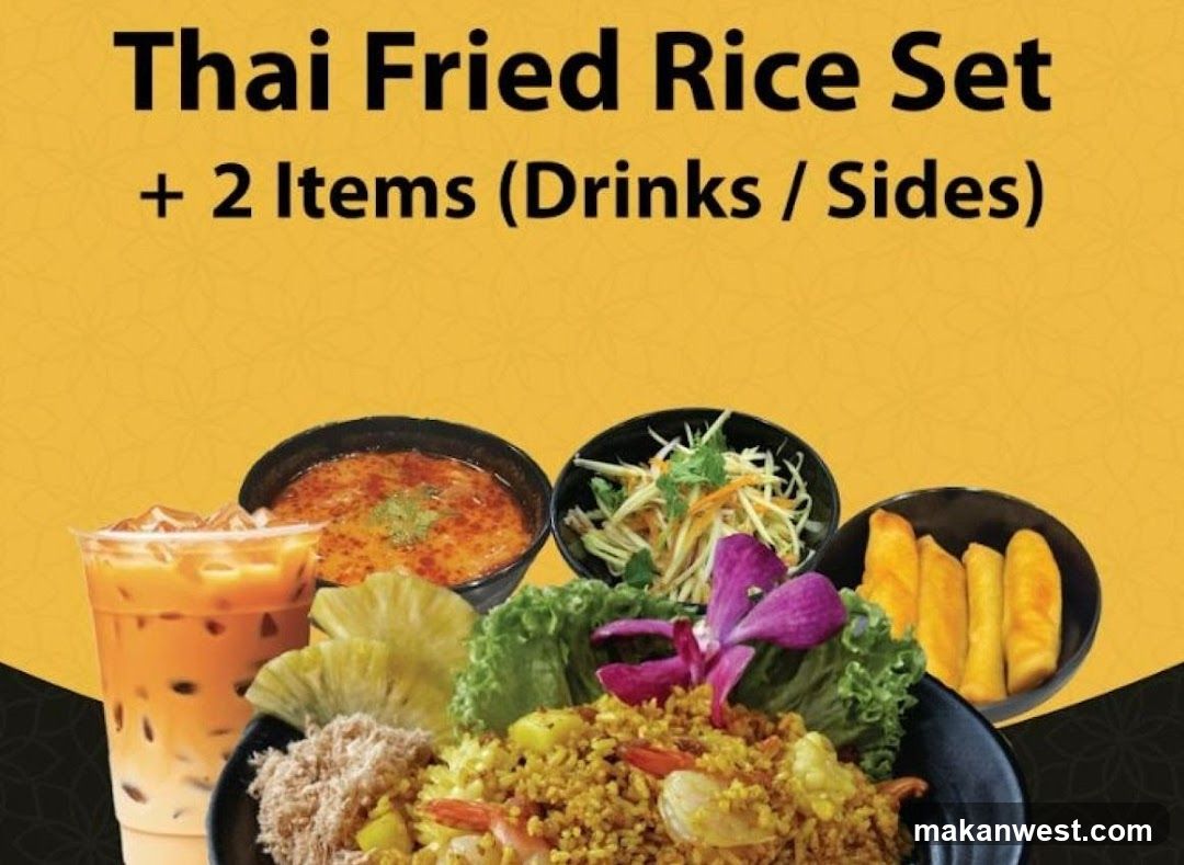 A Thai fried rice set meal with a drink and two sides.
