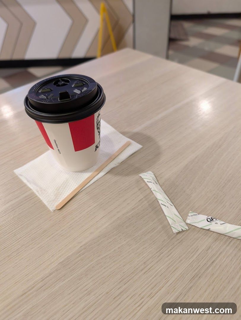 Coffee Cup and Sugar Packets