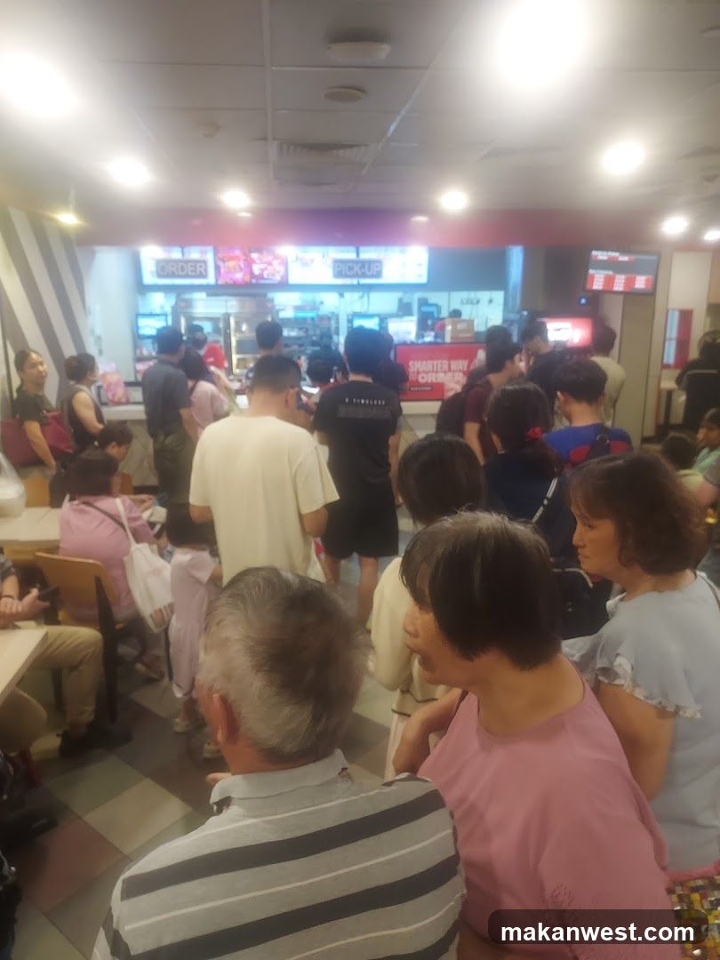 People waiting in line at a fast-food restaurant