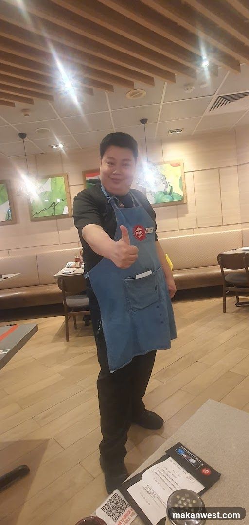 Employee giving a thumbs up