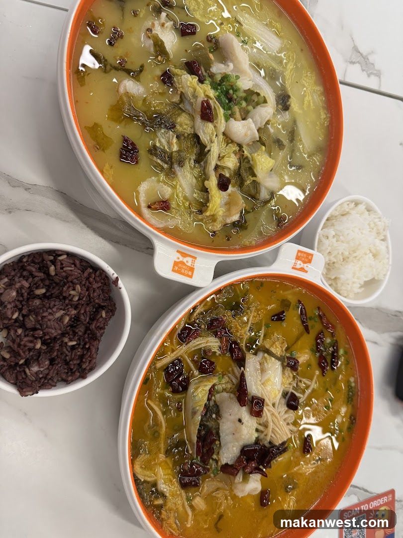 Two bowls of fish soup with rice