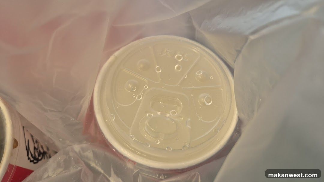 Disposable cup lid in a plastic bag