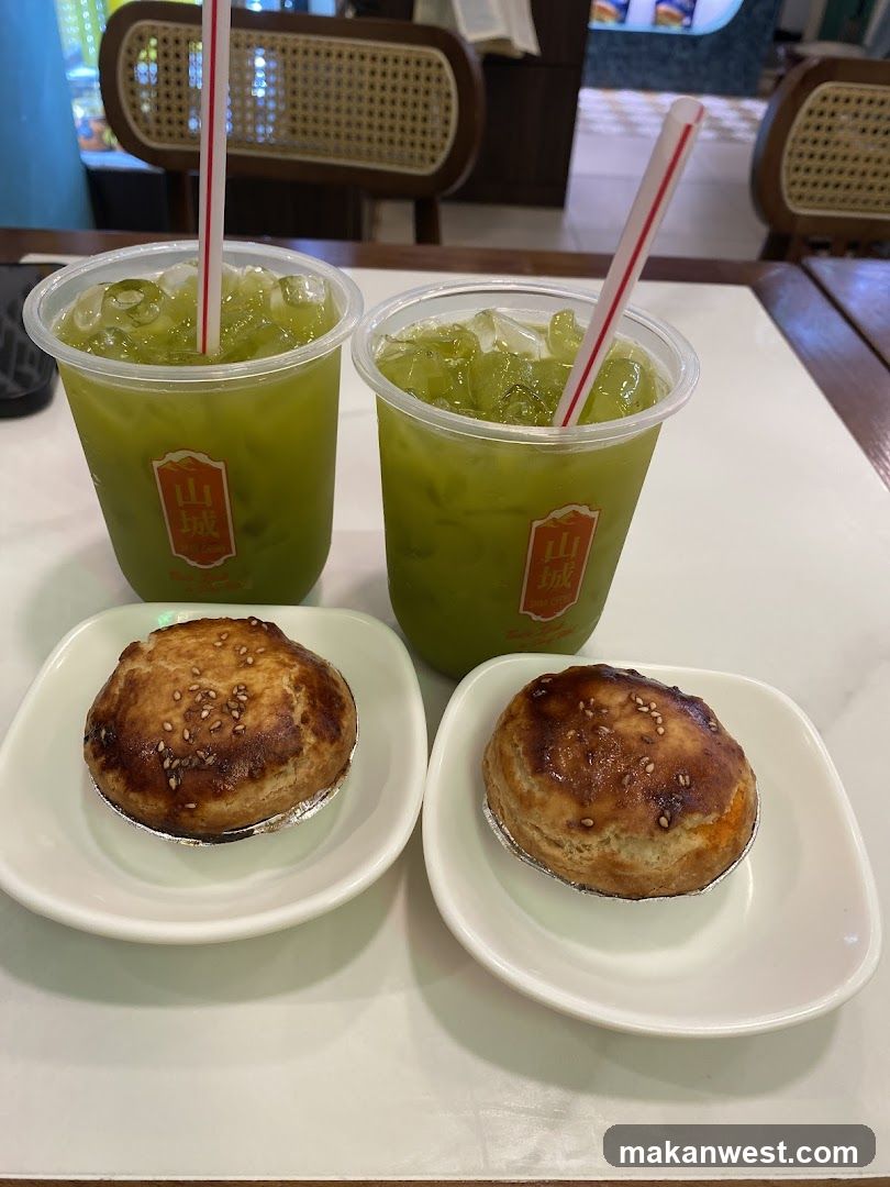 Two green drinks and two pastries