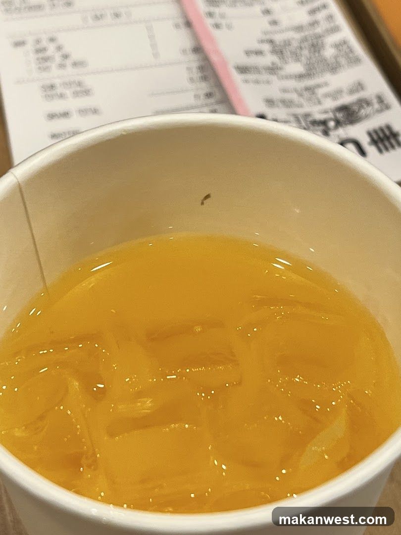 Orange Drink with Ice and Receipt