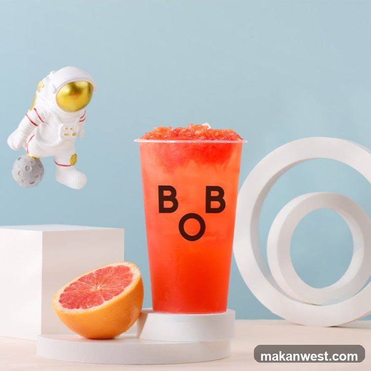 Grapefruit Drink with Astronaut Figurine