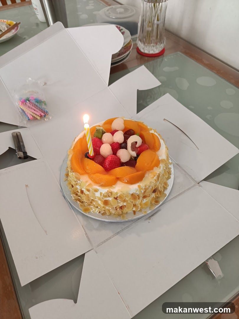Birthday Cake with Fruit and Candle