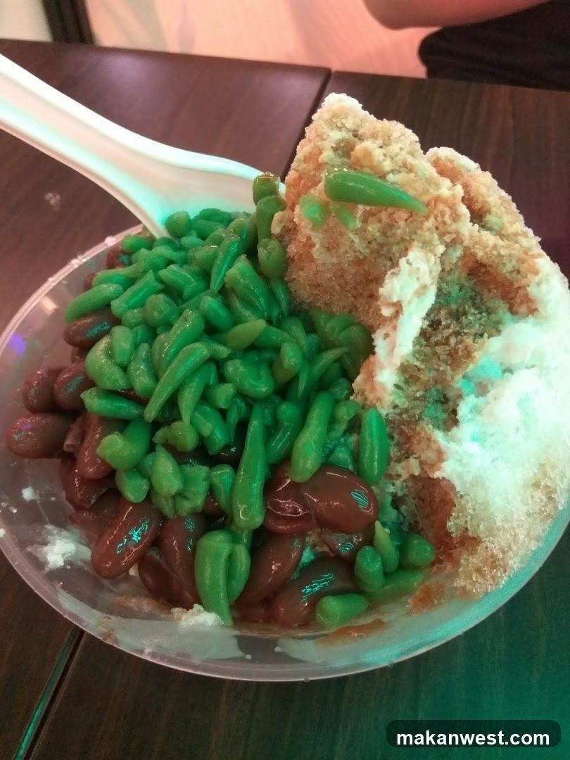 Dessert with shaved ice, red beans, and green jelly