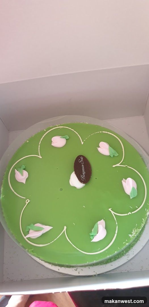 Green Cake with Floral Decorations