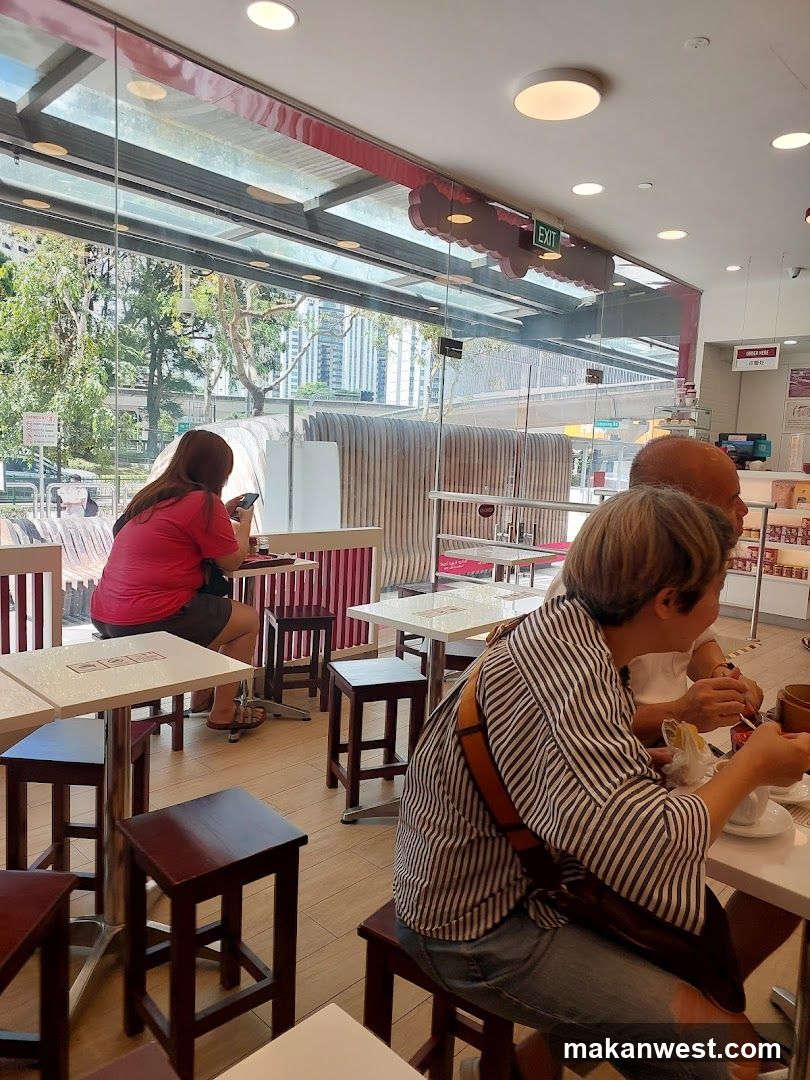 People dining at tables in a cafe