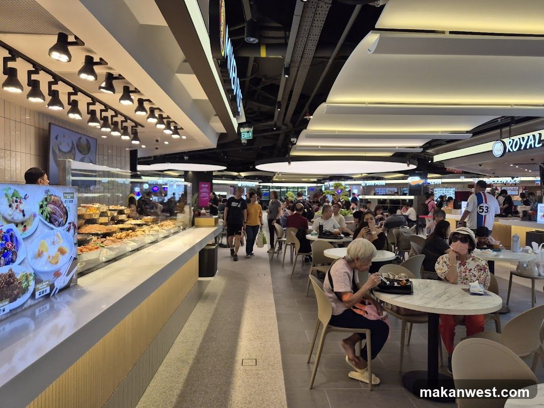 Food court with diverse food stalls and seating areas