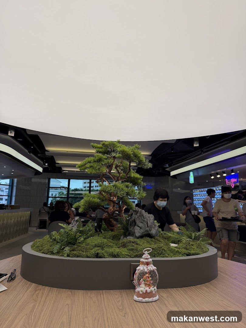 Indoor seating area with a decorative bonsai tree