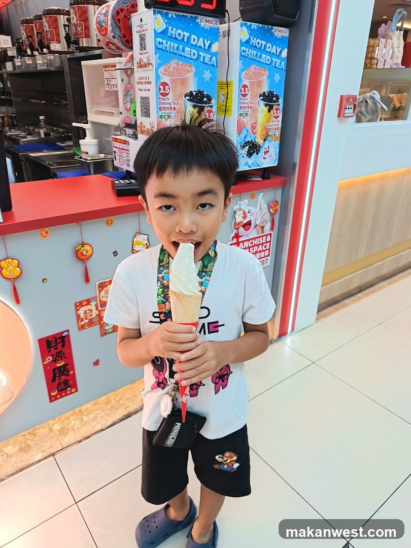 Boy eating ice cream cone