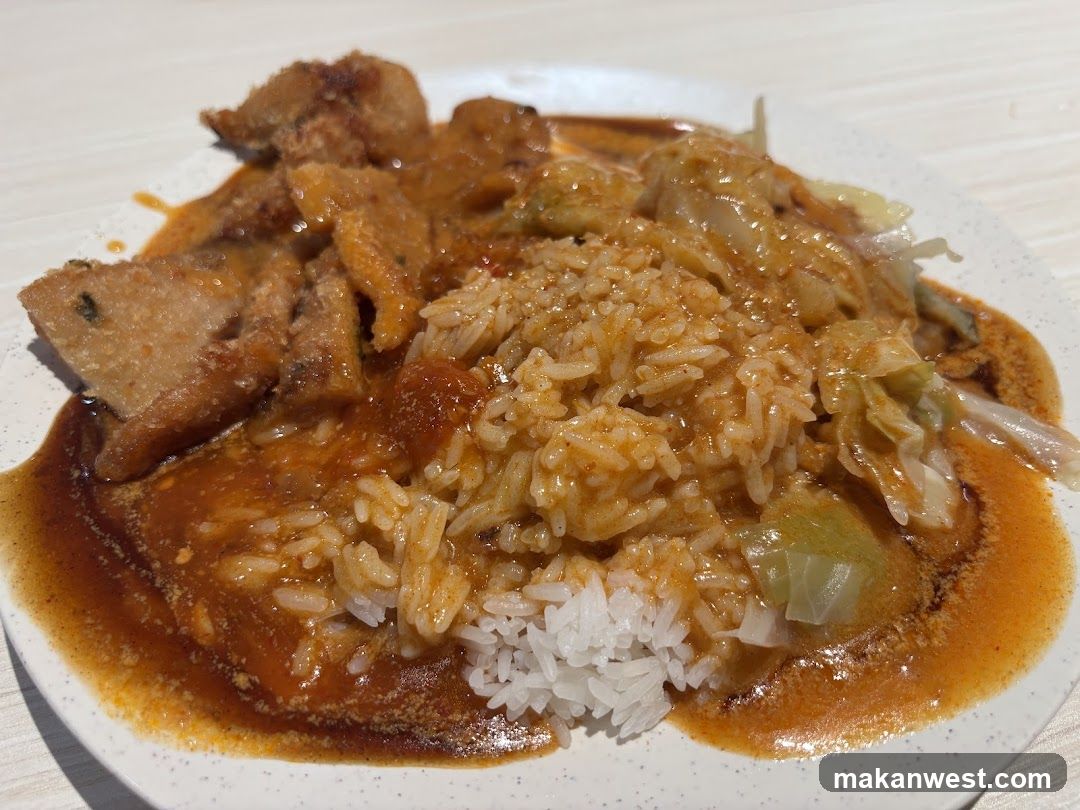 Rice dish with curry and fried items