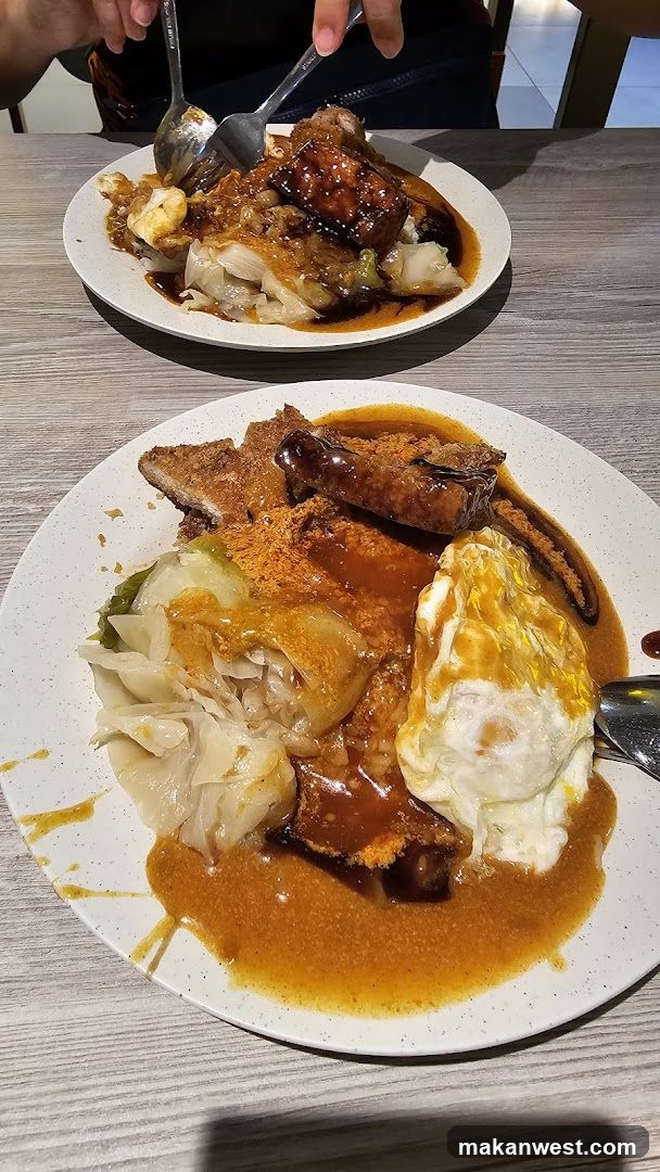 Two plates of food with fried meat and vegetables