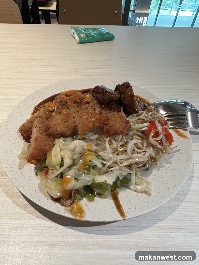 Plate of food with fried chicken and vegetables