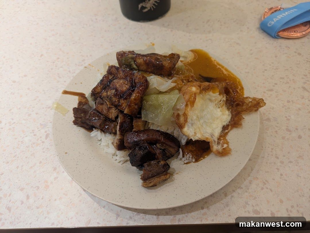 Plate of food with rice, meat, and egg