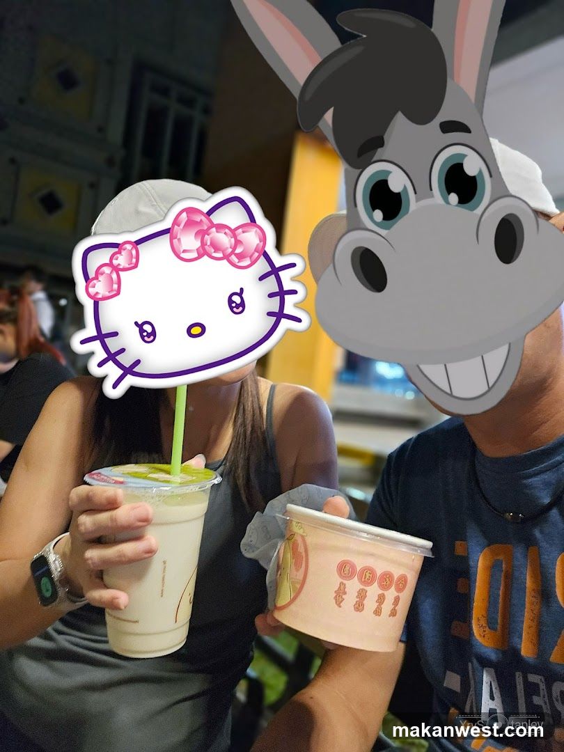People with cartoon masks holding drinks